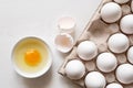 Eggs in a tray and broken egg Royalty Free Stock Photo