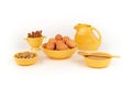 Eggs, Walnuts, Organic Sugar, Cinnamon, in Vintage Yellow Fiesta Ware bowls with Large Pitcher. Royalty Free Stock Photo