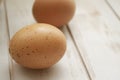 Eggs on weathered wooden table in shebby style, close up