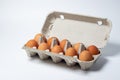 Eggs on a white background. Chicken eggs in a paper box Royalty Free Stock Photo