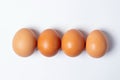Eggs on a white background. Chicken eggs are in a row Royalty Free Stock Photo