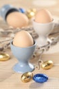 Eggs in white and blue eggcups Royalty Free Stock Photo