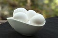 Eggs in a white bowl isoated on black background. Royalty Free Stock Photo