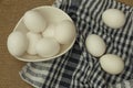 Eggs in a white bowl with napkin on table mat. Royalty Free Stock Photo