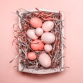 Eggs in a white tray. Creative Easter concept. Modern solid pink background. . Living coral theme - color of the year 2019 Royalty Free Stock Photo