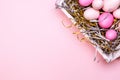 Eggs in a white tray. Creative Easter concept. Modern solid pink