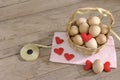 Eggs in a wicker basket with heart-shaped on wooden table Royalty Free Stock Photo