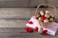 Eggs in a wicker basket with heart-shaped on wooden table Royalty Free Stock Photo