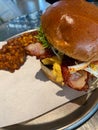 Eggslut Burger with Bacon and Corn Fritters Royalty Free Stock Photo