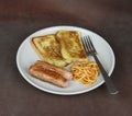 Eggy Bread, spaghetti and sausage breakfast meal Royalty Free Stock Photo