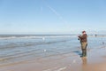 Fisherman with double catch -at the Sea fishing competition along the Northsea shore