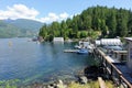 A view of the marina, full of boats and surrounded by forest, along the sunshine coast in Egmont, British Columbia, Canada.