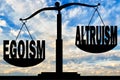 Egoism word takes precedence over the word altruism on the scales Royalty Free Stock Photo