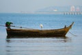 The Egret stood looking for food from a boat anchored by the sea Royalty Free Stock Photo