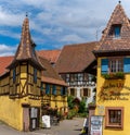 Historic colorful half-timbered houses and wine cellars in the village center of Eguisheim Royalty Free Stock Photo