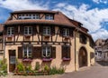 Historic colorful half-timbered houses and wine cellars in the village center of Eguisheim Royalty Free Stock Photo