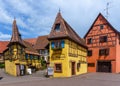 Historic colorful half-timbered houses and wine cellars in the village center of Eguisheim Royalty Free Stock Photo
