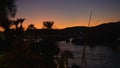 Egypt Aswan Nile river timelapse at sunset vessle and boats beautiful Africa landscape