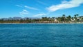 Egypt beach with palm trees, yachts and hotels