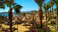 Egypt beach with palm trees, yachts and hotels