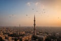 Cairo tower with old mosque and birds flying in cairo in egypt during sunset Royalty Free Stock Photo