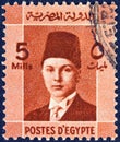 EGYPT - CIRCA 1937: A stamp printed in Egypt shows a portrait of King Farouk, circa 1937. Royalty Free Stock Photo