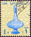 EGYPT - CIRCA 1964: A stamp printed in Egypt shows a 14th century glass vase, circa 1964. Royalty Free Stock Photo
