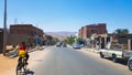Egypt, Dahab - June 20, 2019: an Arab riding a bicycle along one of the streets of Dahab. Desert Street. Egyptian residential
