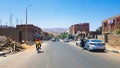 Egypt, Dahab - June 20, 2019: an Arab riding a bicycle along one of the streets of Dahab. Desert Street. Egyptian residential