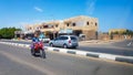 Egypt, Dahab - June 20, 2019: an Arab riding a scooter along one of the streets of Dahab. Desert Street. Egyptian residential