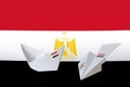 Egypt flag depicted on paper origami airplane and boat. Handmade arts concept