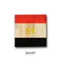 Egypt flag on a wooden block. Isolated on white background. Signs and symbols