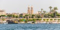 Luxor, Egypt - April 16, 2019: River Nile and the Christian church, view from a boat, Luxor, Egypt