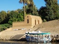 Egypt, Nile, Egyptian house on bank of river, with boat moored Royalty Free Stock Photo