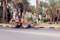 Egypt, Hughada, 17 may 2019, two drivers on bulldozer and a man in the bucket Royalty Free Stock Photo