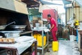 Egyptian fish market worker preparing street food