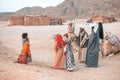 Egypt / Hurghada - 01/05/2016: Bedouin families and camels in the desert