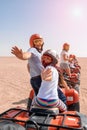 Egypt / Hurghada - 01/05/2016: A group of happy people ride quad bikes in the desert Royalty Free Stock Photo