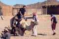 Egypt, Hurghada, 12 may 2019, beduins and tourits ride a camels in the desert