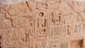 EGYPT, LUXOR - MARCH 01, 2019: ancient Egyptian hieroglyphs, drawings and inscriptions on the walls and columns in the temple of