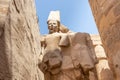 Egypt Luxor Temple. granite Statue of Ramses II seated in front of columns Royalty Free Stock Photo