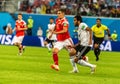 Egypt national team striker Marwan Mohsen against Russia national team midfielder Roman Zobnin