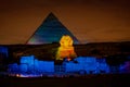 Egypt night at the Pyramids with the Sphinx illuminated