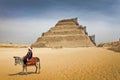 EGYPT'S OLDEST PYRAMID, SAQQARA STEP PYRAMID, Egypt. Bedouin on a donkey