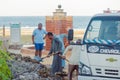 Egyptian workers cleaning hotel beach