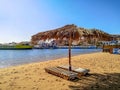 Tourist port with boats in Sharm el-Maya bay Red Sea on the hotel sand beach in Sharm