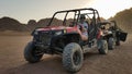 Egypt, Sharm El Sheikh - October 10, 2020. Active woman driving an ATV on a dirt road in the desert against the backdrop of rocky