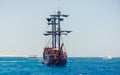 Sailing tour boat above clear sea