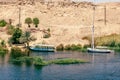 Egypt Summer Travel. Riverside Tranquility: Small Boats Viewed from Nile Cruise