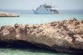 Egyptian beach with rock island and boat at Red sea Royalty Free Stock Photo
